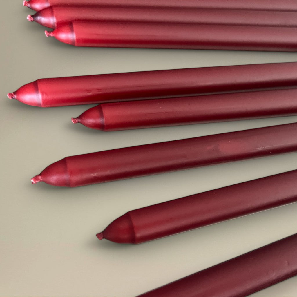 rawLight coloured taper candles in various red shades, 22x300mm, elegant dining and event lighting